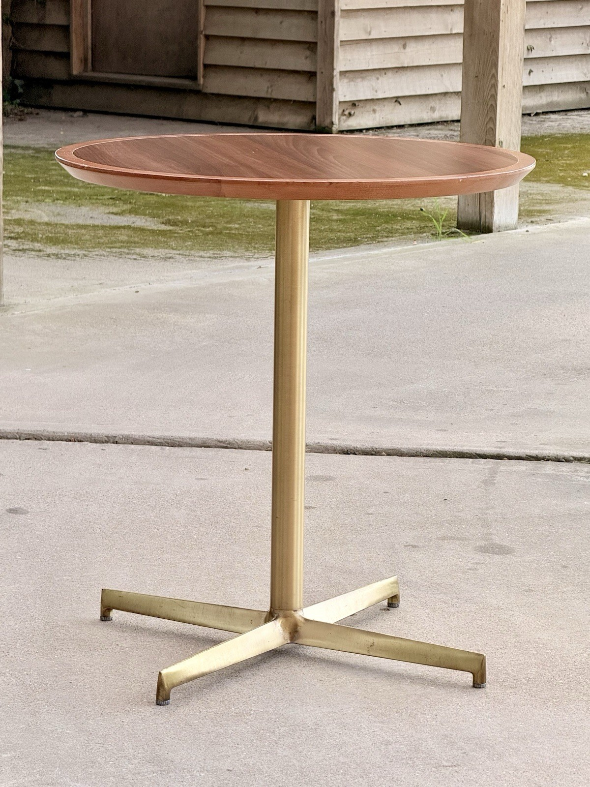 Pedrali mahogany finish side table, front view outdoors