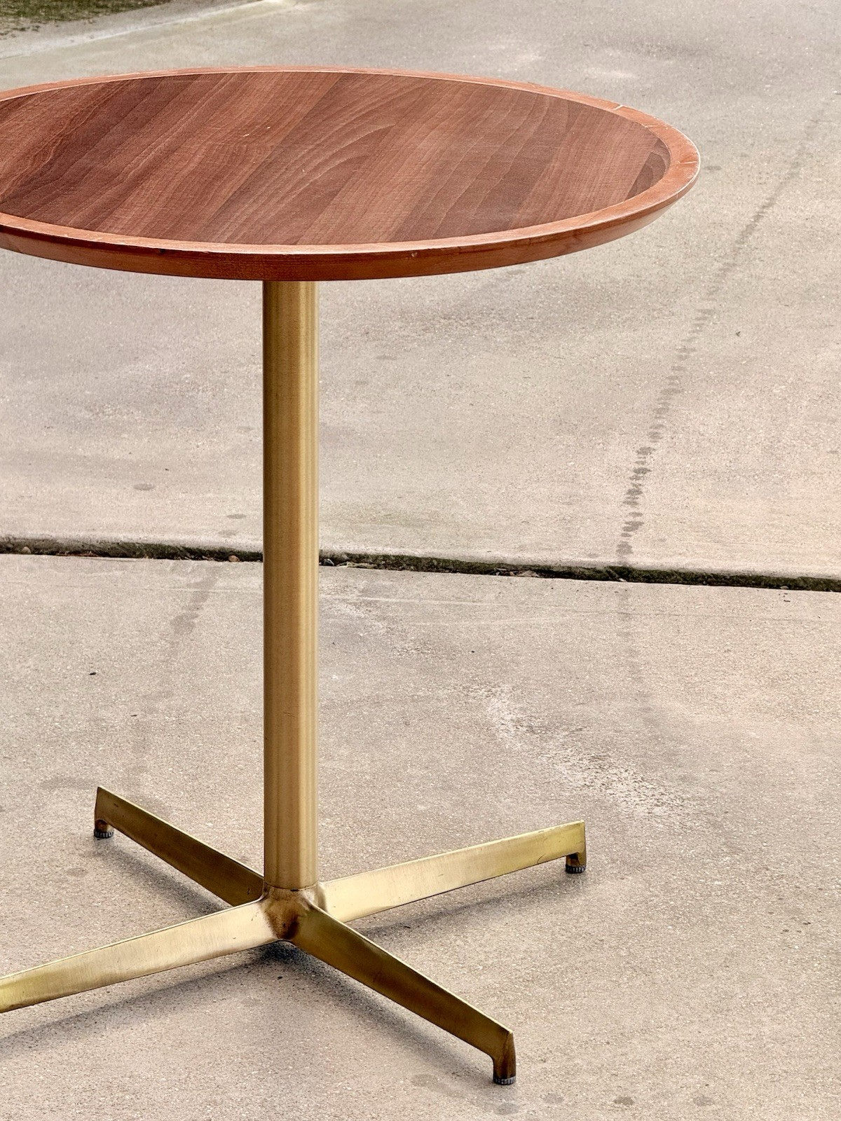 Pedrali mahogany finish side table, angled view outdoors