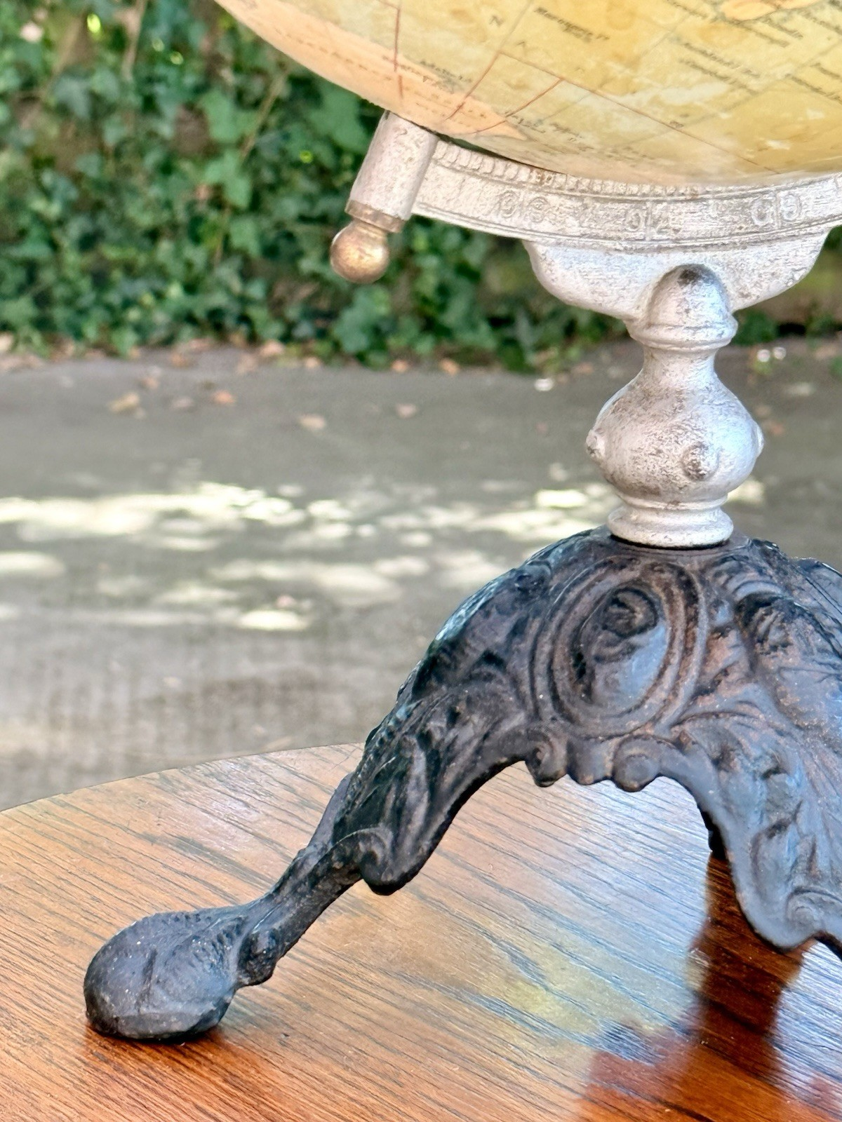 Close-up of the cast iron tripod base and turned stem