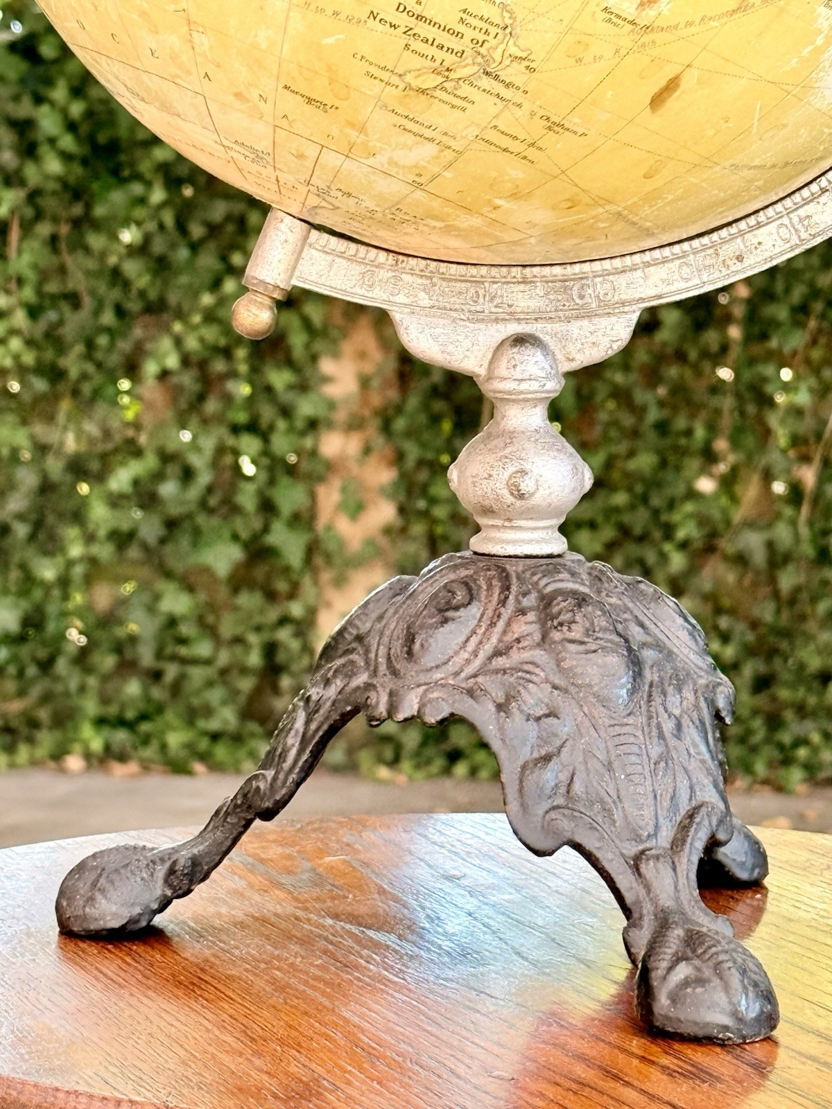 Cast iron scrolled foot of the Philips globe stand