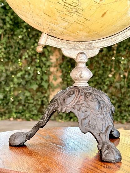 Cast iron scrolled foot of the Philips globe stand