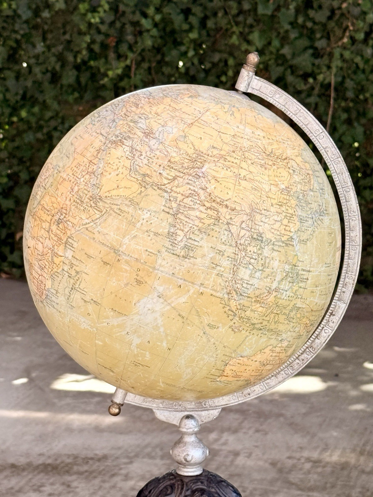 Close-up of globe surface and meridian ring