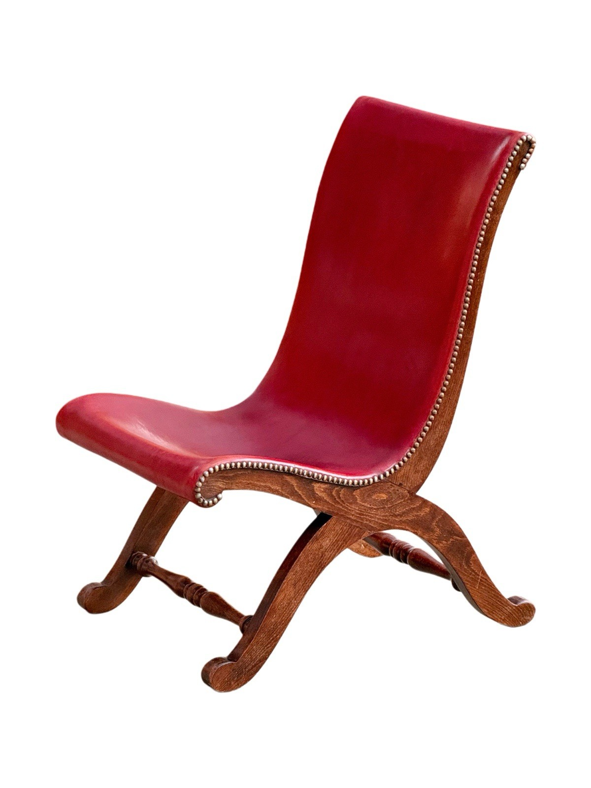 Pierre Lottier for Valmazan red leather slipper chair, three-quarter view