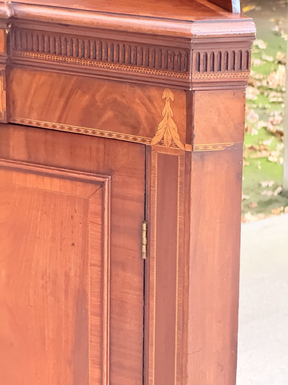 Close-up of dentil cornice and inlaid fan corner, mahogany cabinet