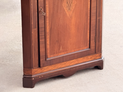 Close-up of the cabinet base and crossbanded door