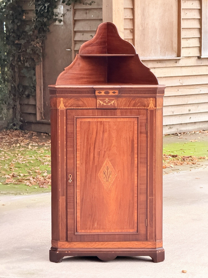 Edwards & Roberts mahogany inlaid corner cabinet, front view outdoors