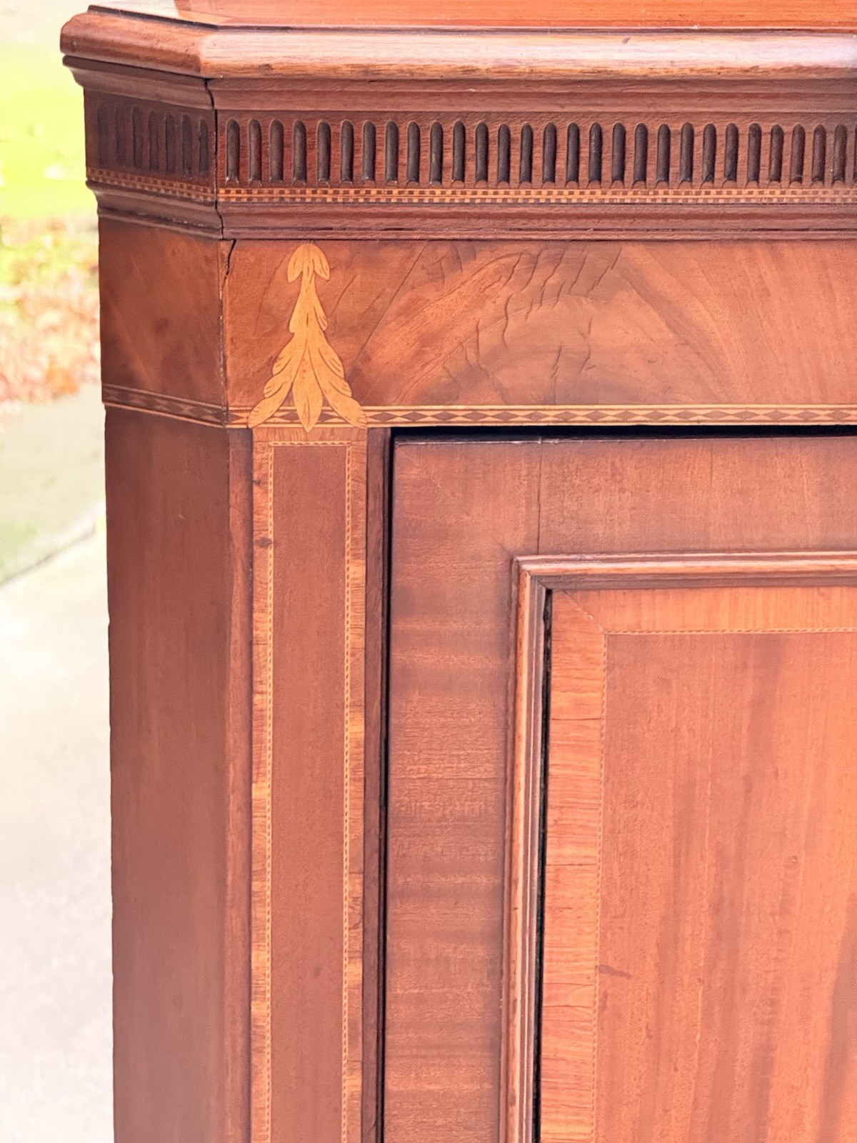 Close-up of inlaid frieze and crossbanded door corner