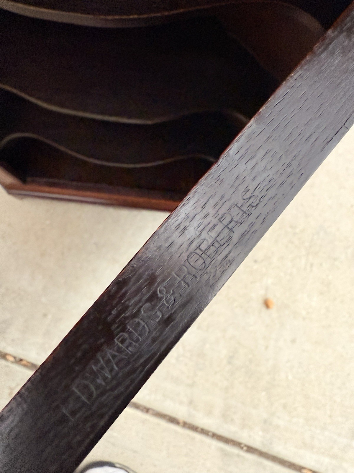 Close-up of maker's stamp inside the Edwards & Roberts cabinet