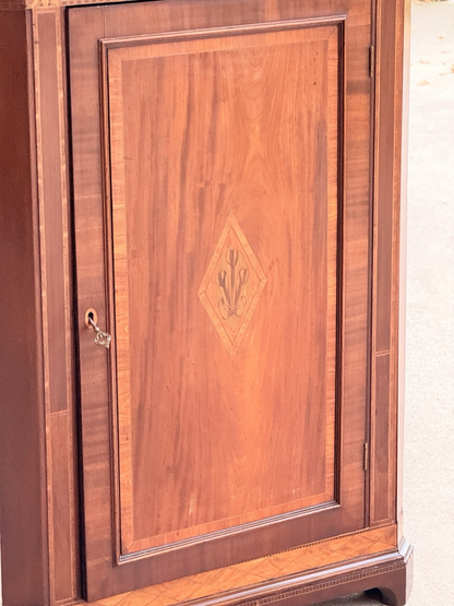 Close-up of the inlaid lozenge door panel and brass lock