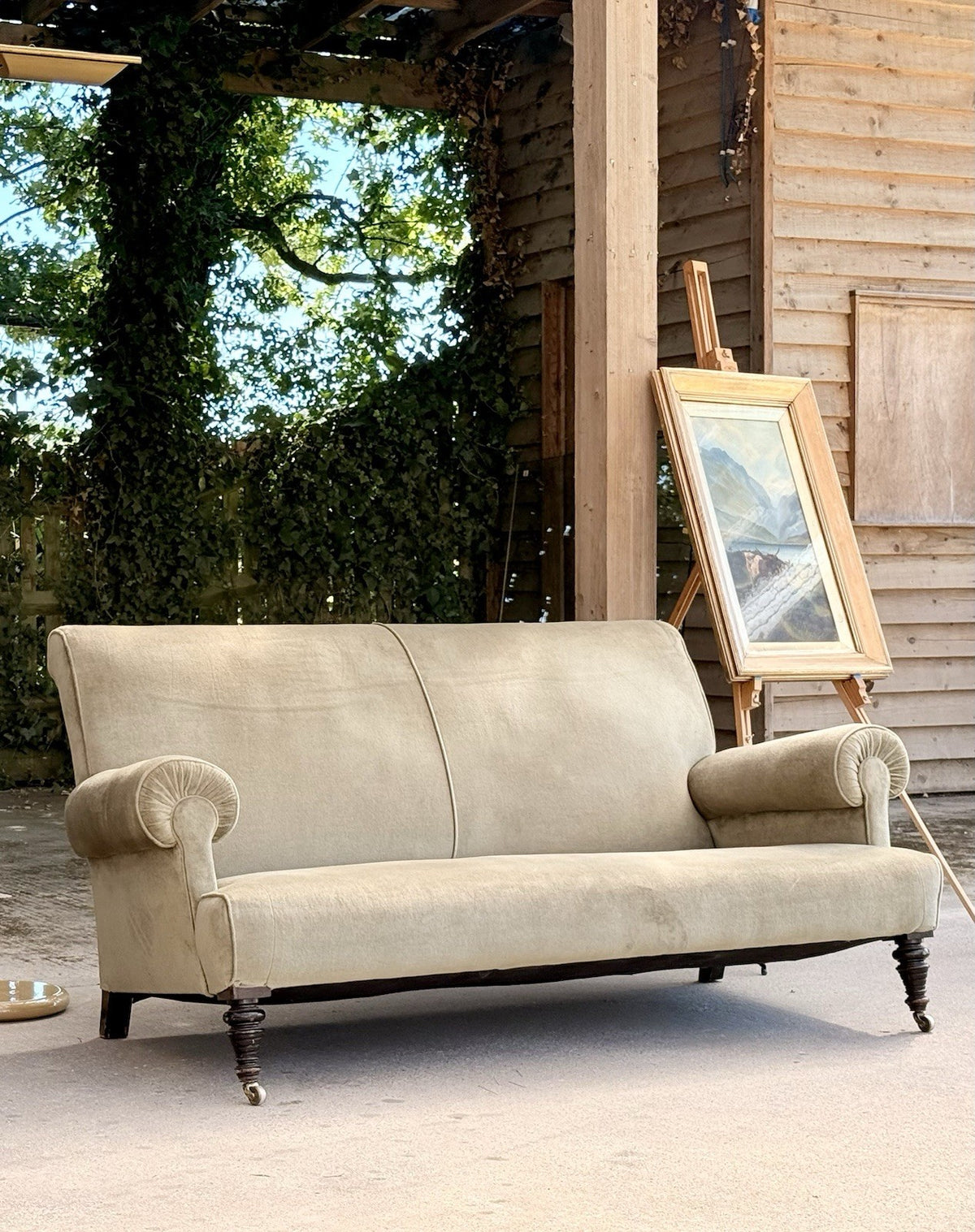 19th-century English sofa, front view with easel in background