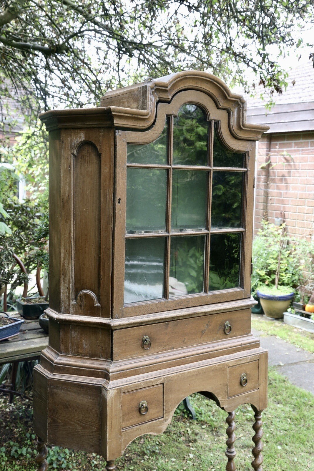 Barley twist pine bookcase on stand, three-quarter view from the right