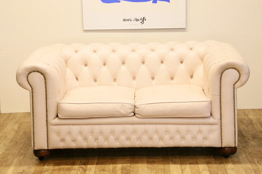 Cream leather Chesterfield 2 seater sofa, front view