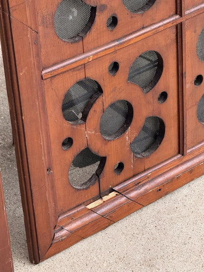Close-up of crack and wear on a pierced pine panel corner