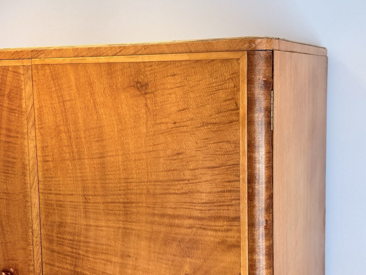 Close-up of figured maple veneer at the top corner