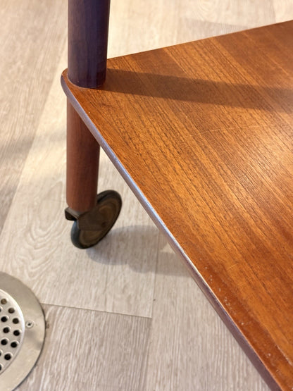Close-up of castor wheel and teak shelf, Bowa drinks trolley