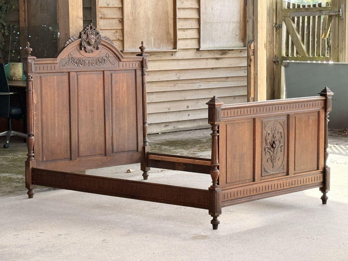 Antique French oak double bed, side view showing rails