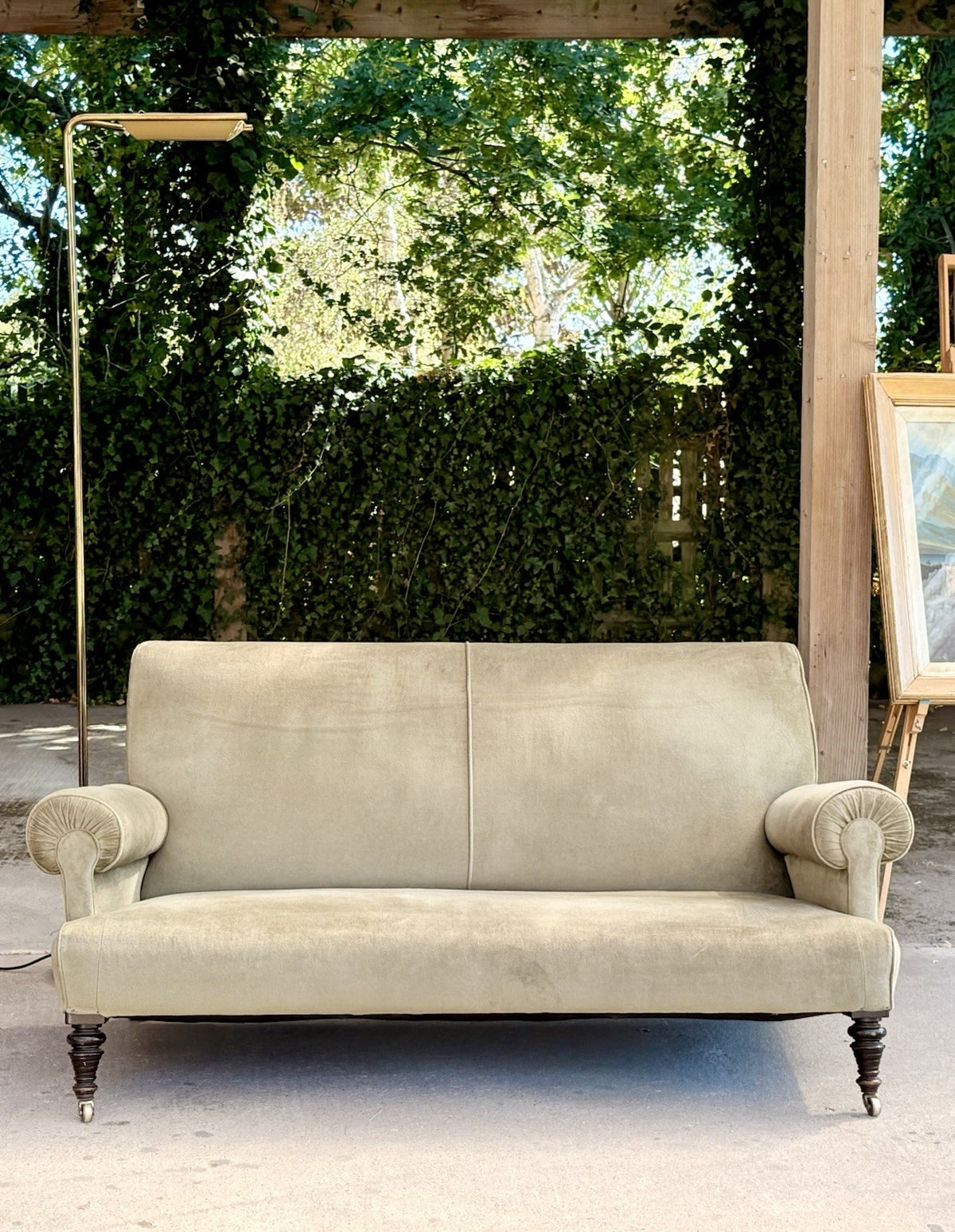 19th-century neo-classical sofa in sage velvet, front view outdoors