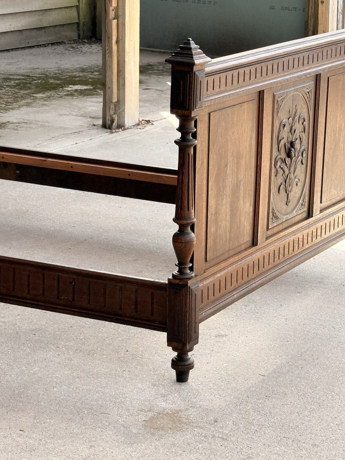 French Henri II bed footboard, angled view with side rail