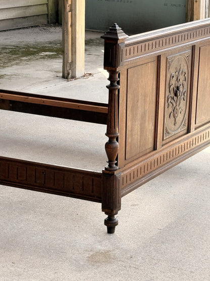 French Henri II bed footboard, angled view with side rail