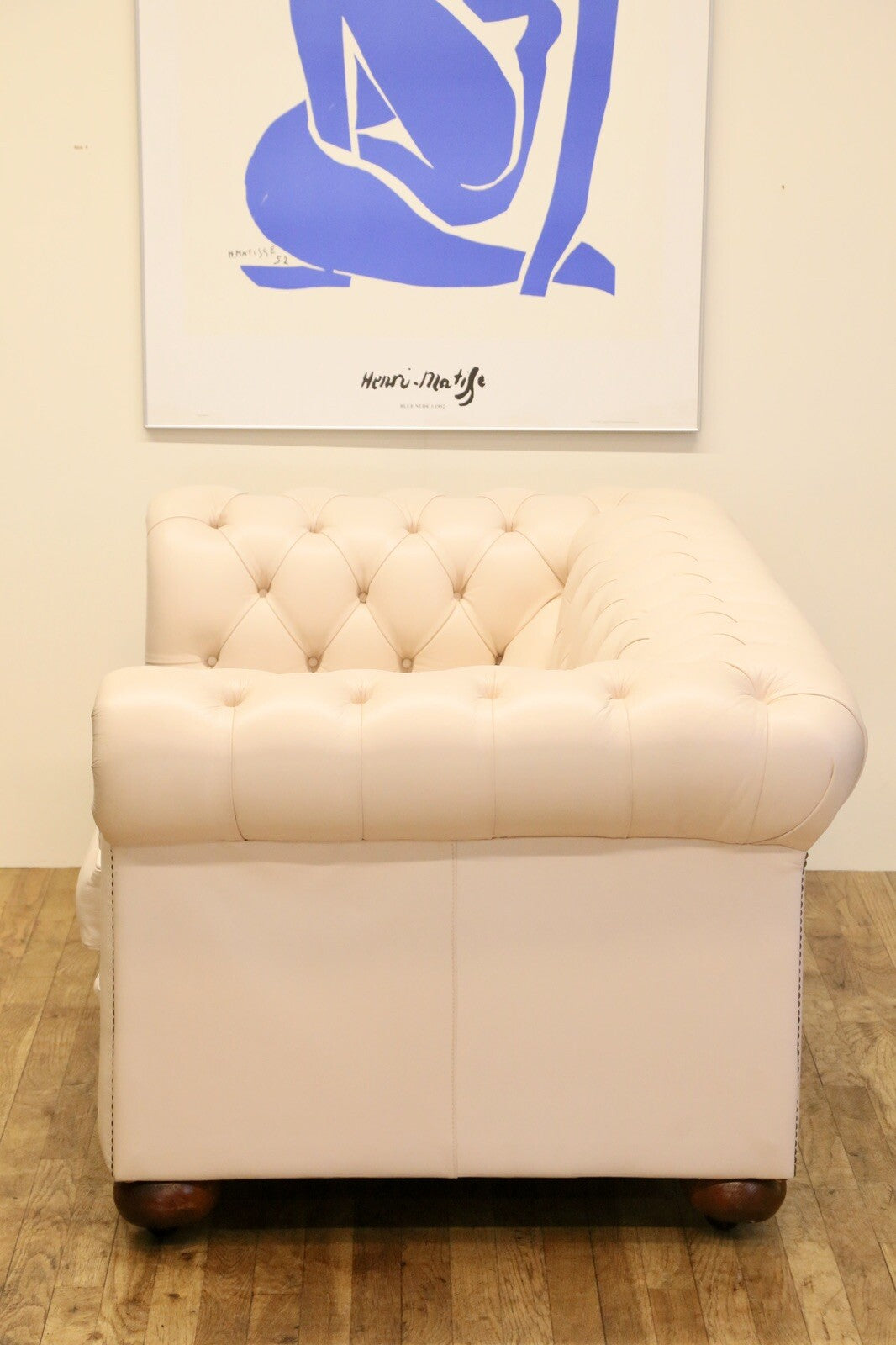 Cream Chesterfield sofa, opposite end view
