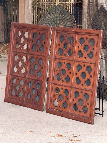 Pair of carved pine quatrefoil panels, angled front view