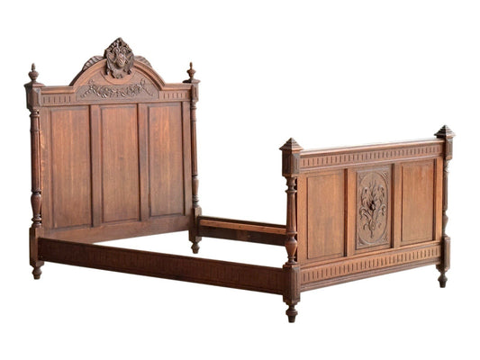 Antique French oak Henri II Renaissance Revival double bed, c.1890, with carved crest headboard and panelled footboard