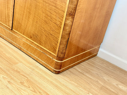Close-up of wardrobe corner and plinth, bird's eye maple