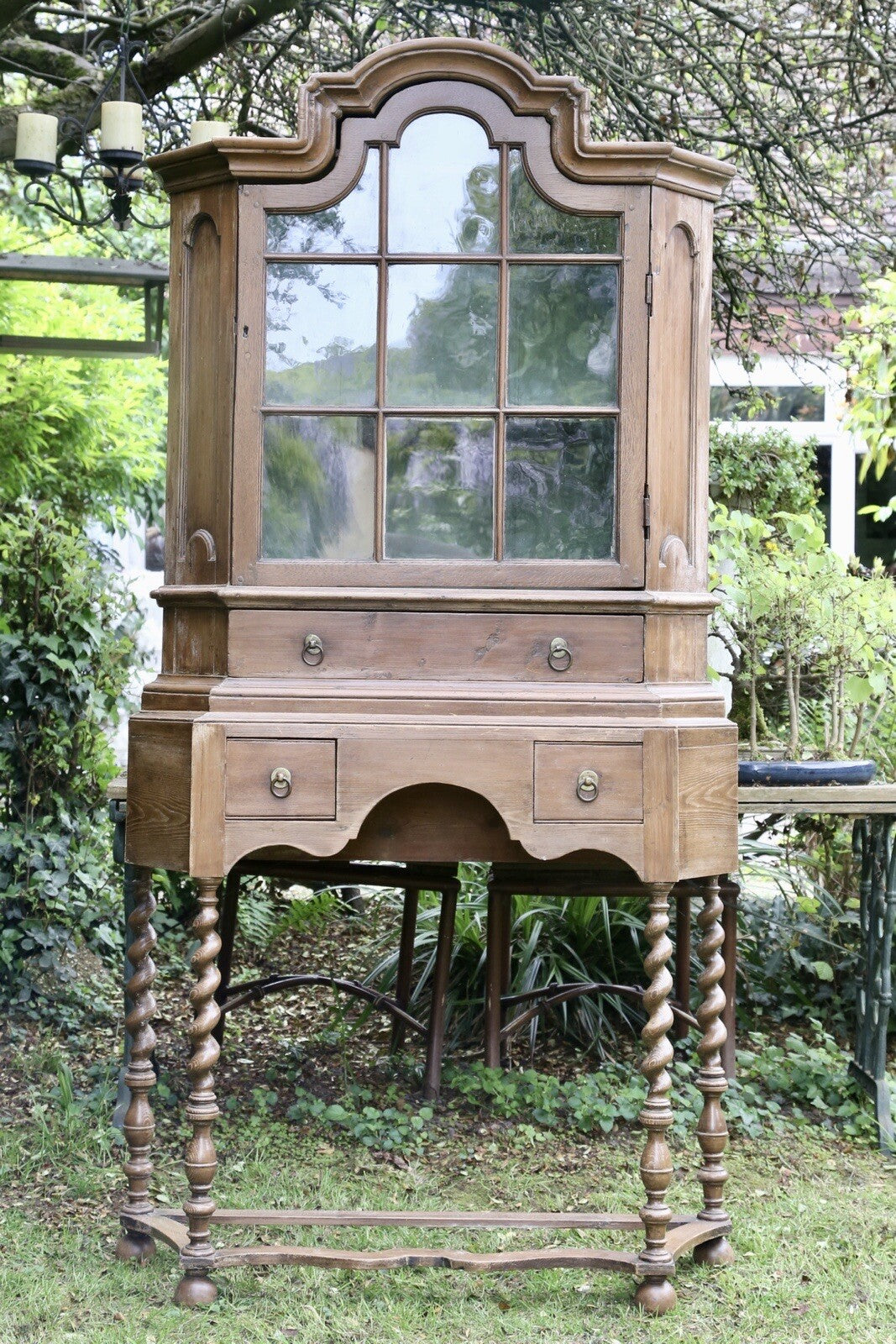 Antique William & Mary style Victorian pine glazed bookcase on stand with arched pediment and barley twist legs