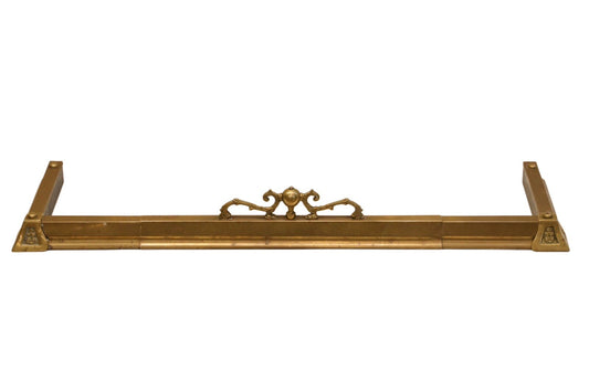 French antique brass fireplace fender with brass bow and ribbon centre mount and decorated corner blocks
