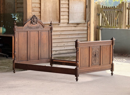 French Henri II carved oak double bed, assembled, three-quarter view