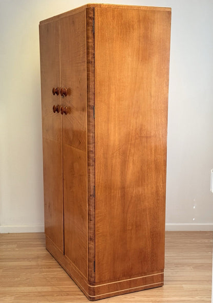 Mid-century bird's eye maple wardrobe, three-quarter view from the left