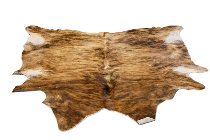 Luxurious Brazilian brindle cowhide rug with natural tan, brown and black striped markings