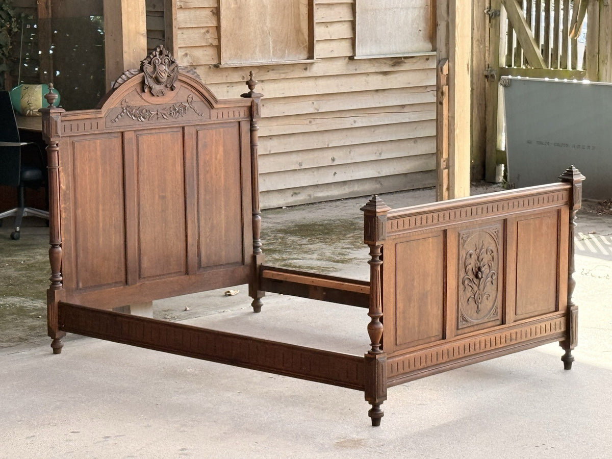 French antique oak Henri II double bed, assembled, side view