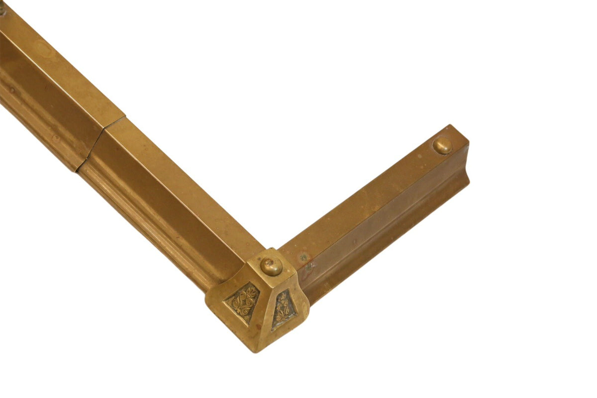 Brass hearth fender corner block, view from above