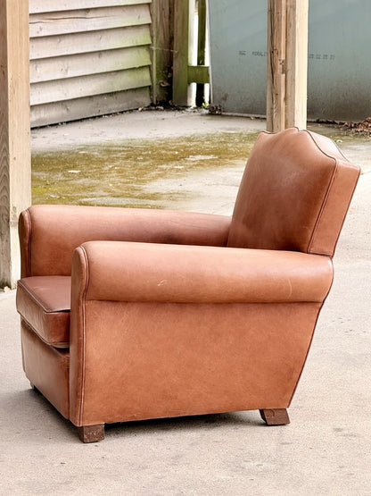 French Art Deco moustache leather club armchair, side view