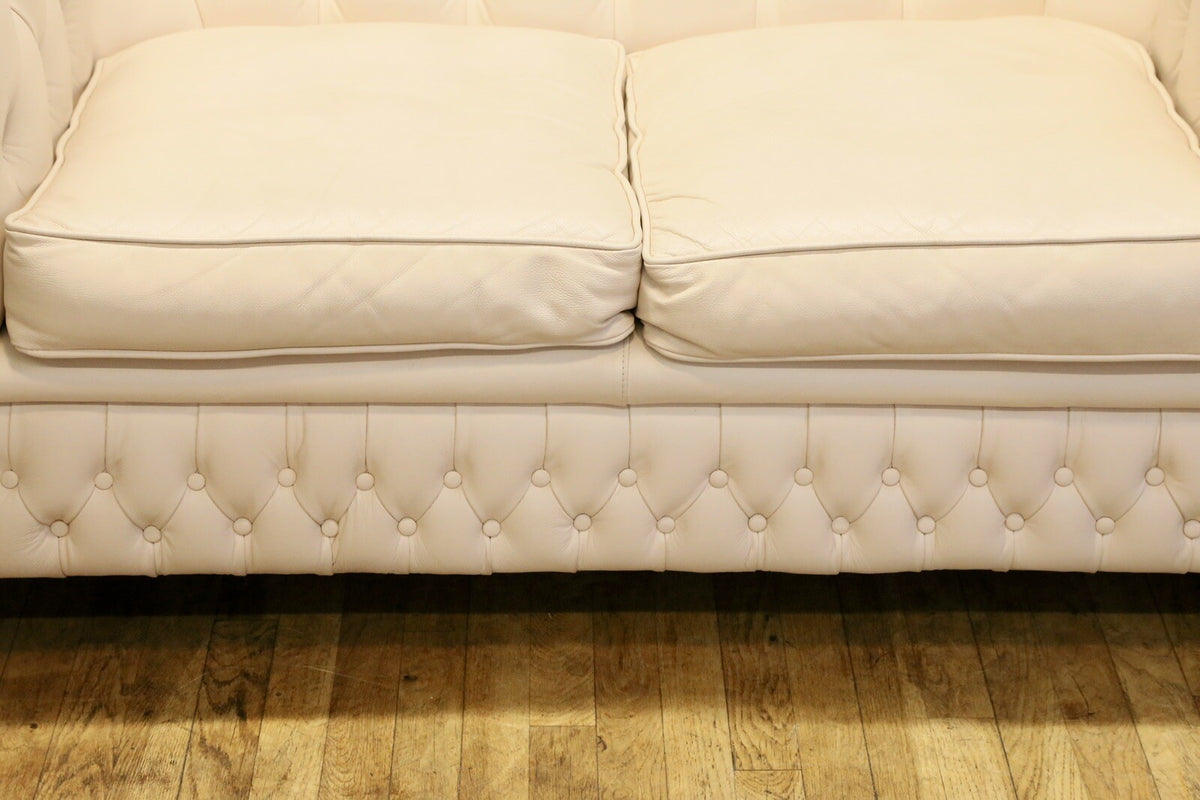 Close-up of seat cushions and buttoned front rail, Chesterfield sofa