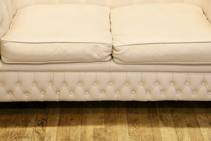 Close-up of seat cushions and buttoned front rail, Chesterfield sofa