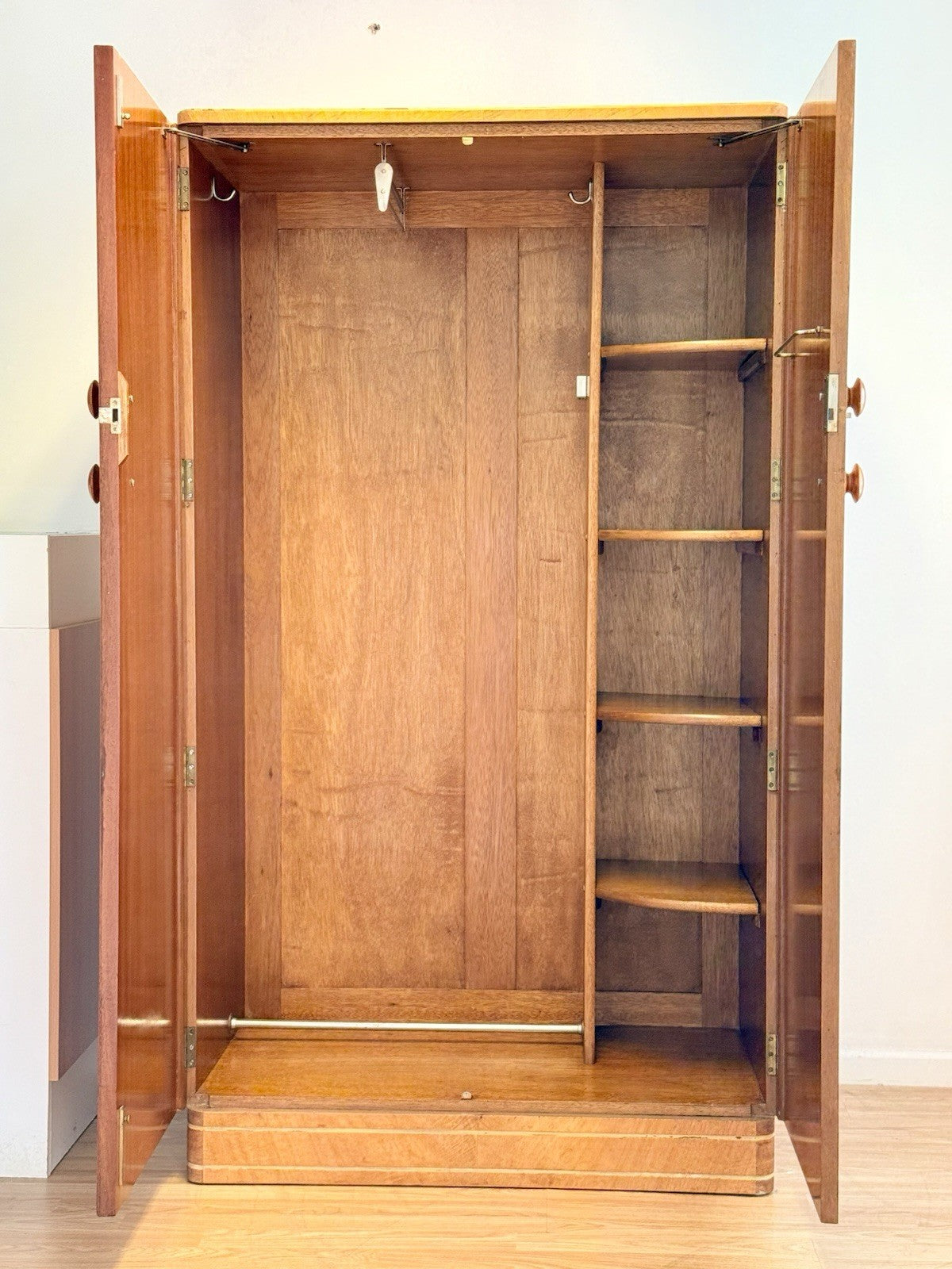 Bird's eye maple wardrobe with doors open, hanging rail and shelves
