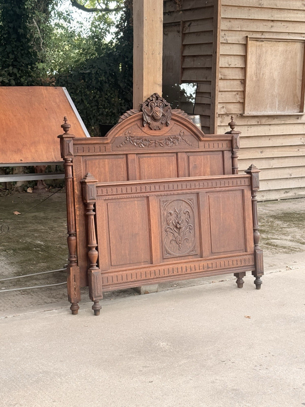 French oak Henri II bed headboard and footboard stood together