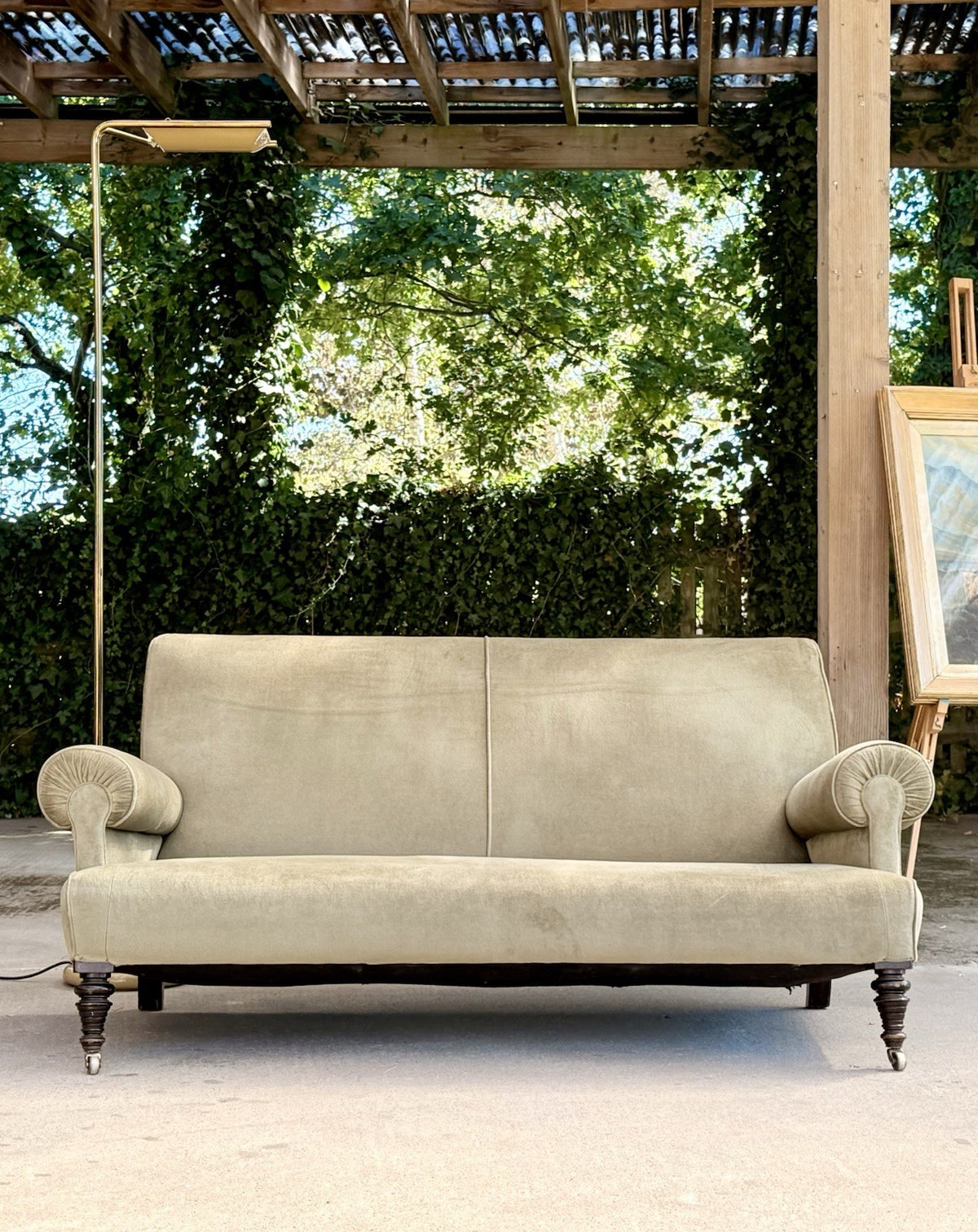 Neo-classical English sofa, low front view showing turned legs