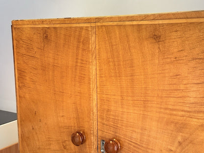Close-up of upper doors, figured bird's eye maple