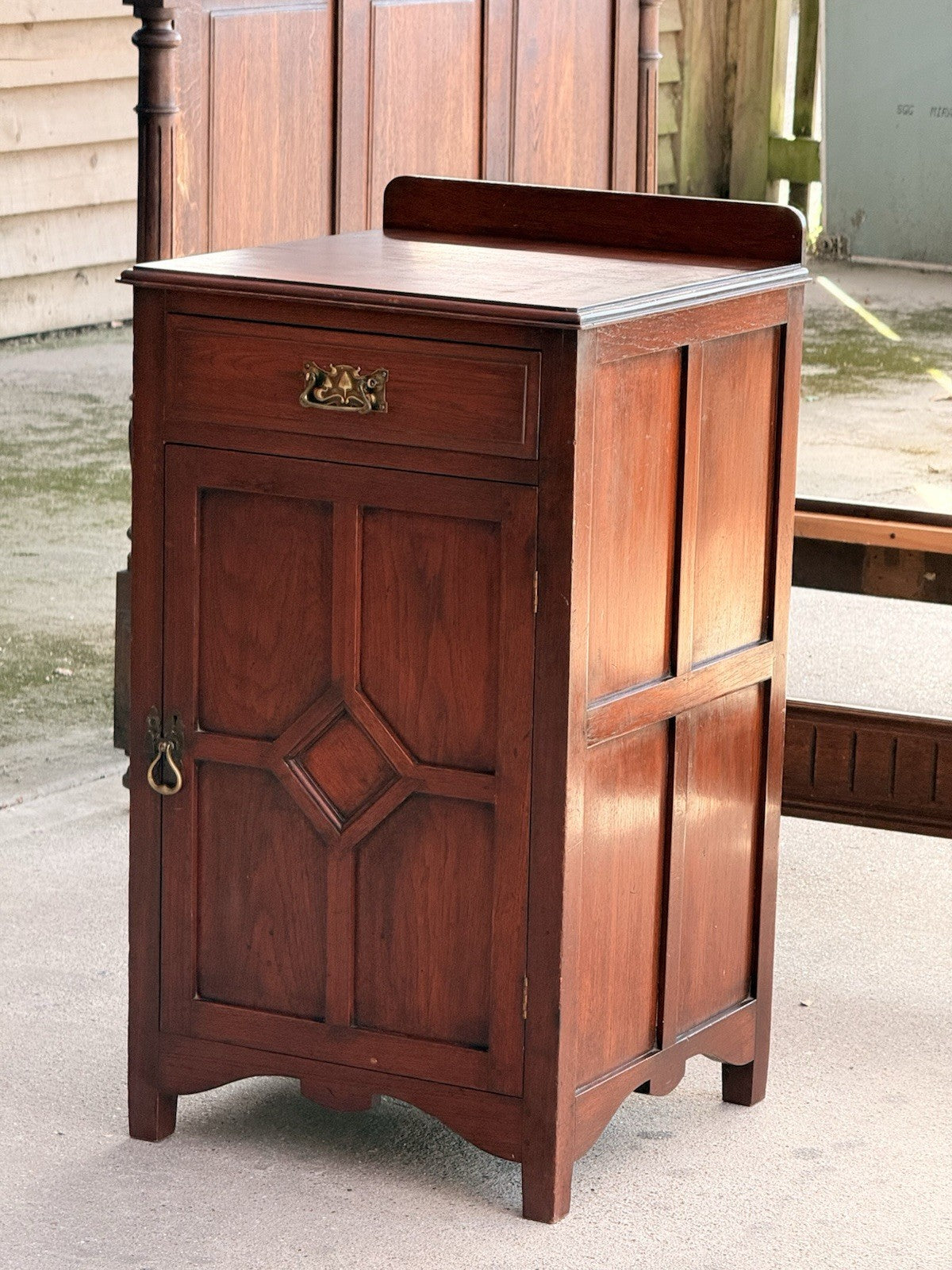 Arts & Crafts mahogany side cabinet, front three-quarter view