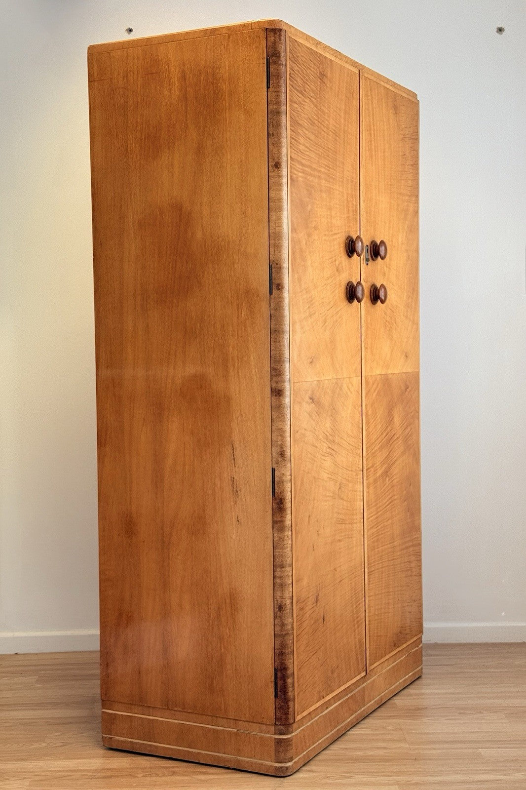 Mid-century bird's eye maple wardrobe, three-quarter view