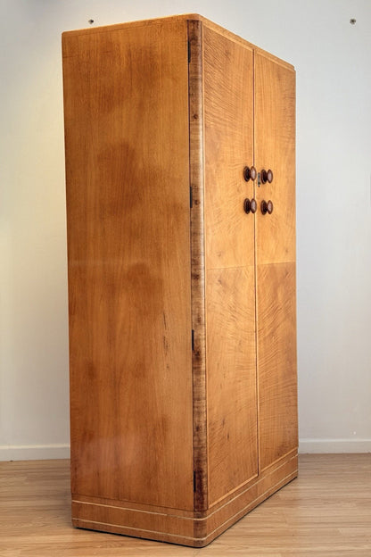 Mid-century bird's eye maple wardrobe, three-quarter view