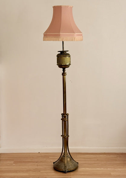 Hine & Co tall brass floor lamp, electrified standard oil lamp with fluted urn top, tripod base and pink pleated shade