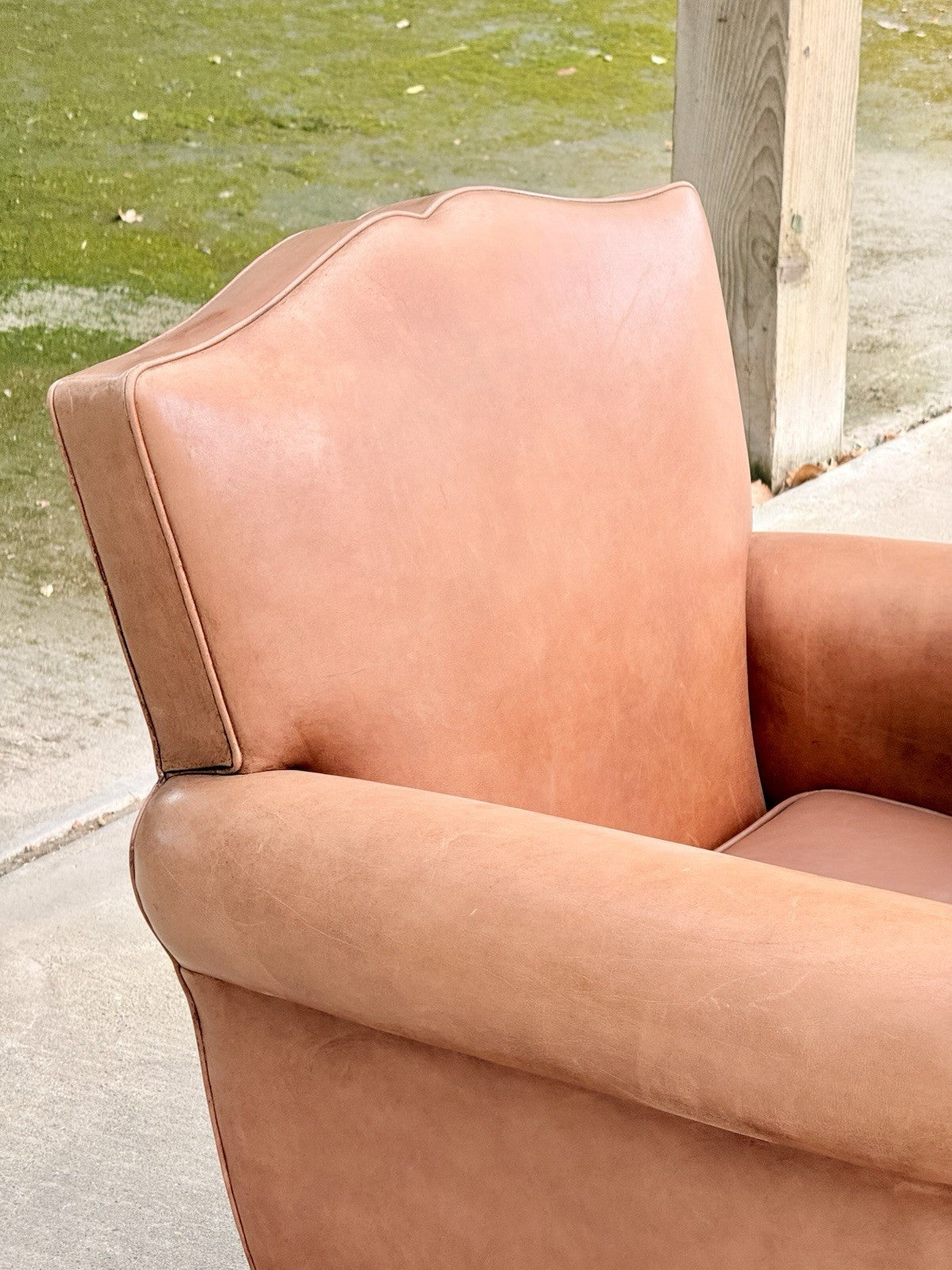 Close-up of arched moustache back and rolled arm, Art Deco club chair