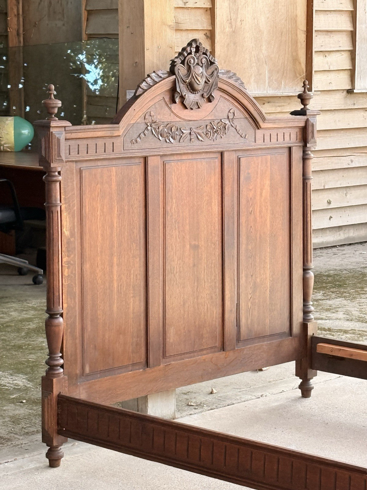 French oak Henri II bed headboard, three-quarter view