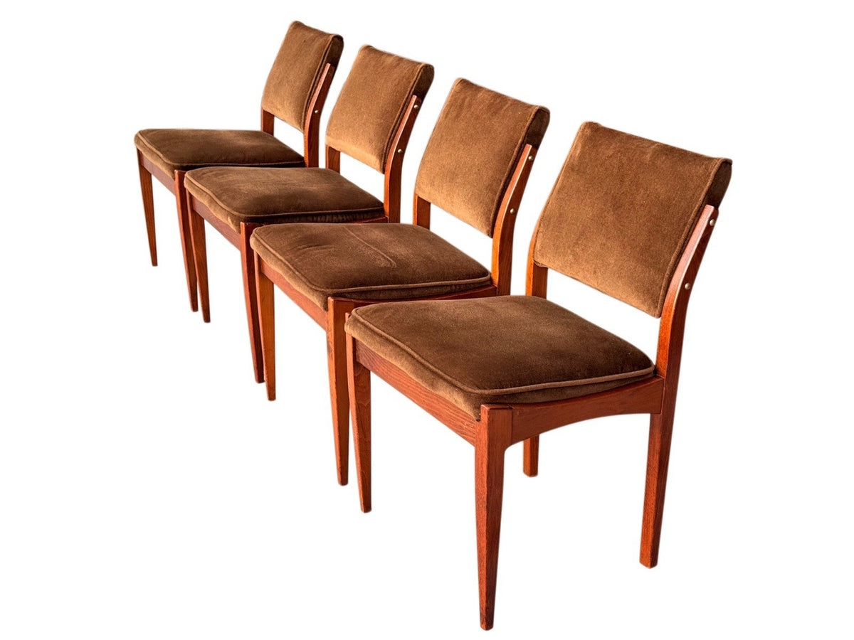 Set of four mid-century upholstered dining chairs, angled view