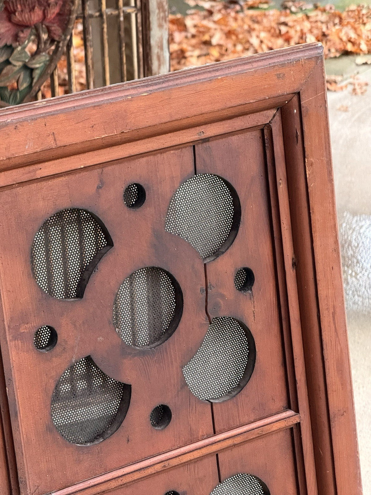 Close-up of mesh-backed quatrefoil and moulded frame
