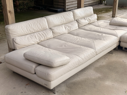 Roche Bobois Scénario ivory leather modular sofa, three-quarter view with bolster cushion